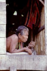 Sea gypsy woman resting out of the midday heat,burma. by Allen Ayling 